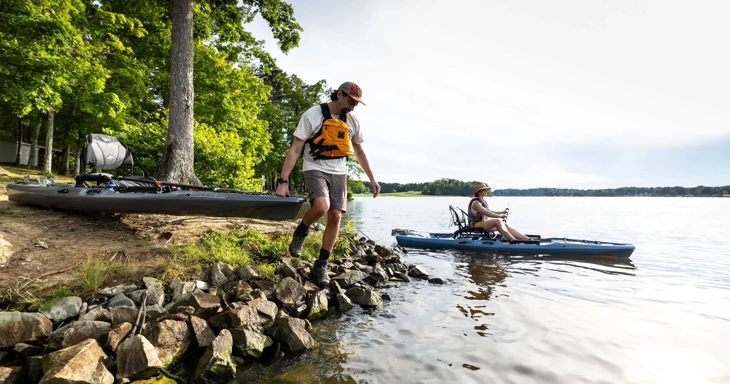 Two kayakers dip into Hyco Lake on a beautiful day