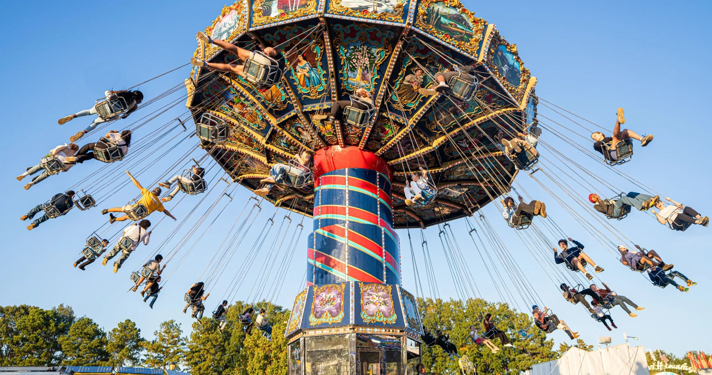 Event goers enjoy the nostalgic thrill of an aerial carousel at the North Carolina State Fair in Raleigh 