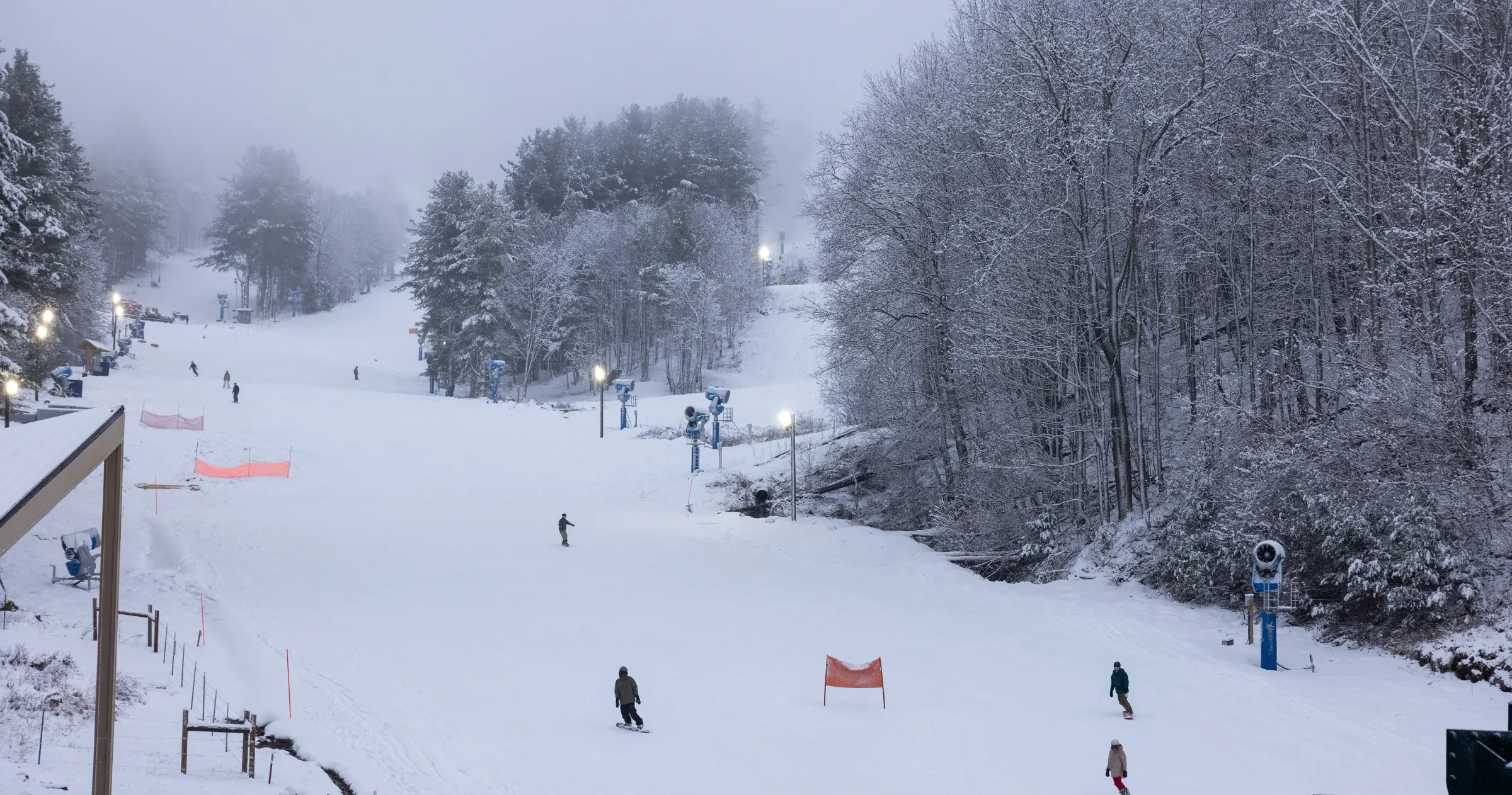 Skiiers and snowboarders enjoy fresh powder at at Hatley Pointe Boutique Mountain Resort