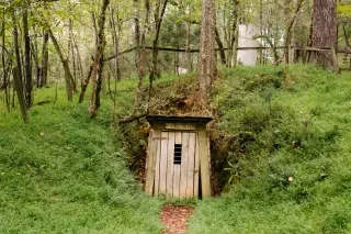 Old saw mill door entrance in forest