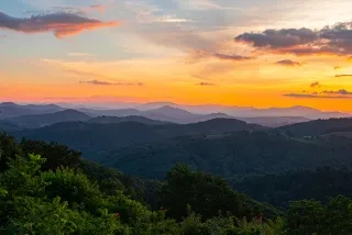 Orange, pink and purple sunset over the Blue Ridge Mountains near Doughton Park.