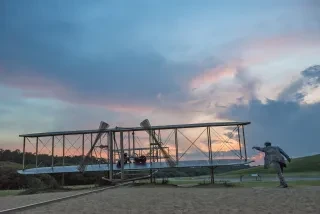 Wright Brothers National Memorial from behind during sunset.