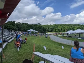 Games field at Grandfather Mountain Highland Games with Grandfather Mountain in distance.