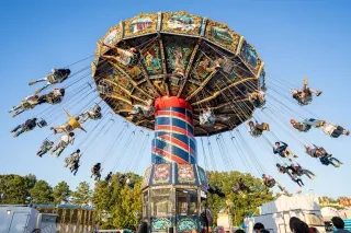 Event goers enjoy the nostalgic thrill of an aerial carousel at the North Carolina State Fair in Raleigh 