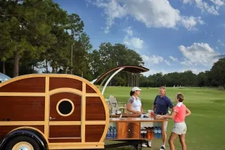 People ordering drinks out of the Pinecone mobile bar at Pinehurst Resort.
