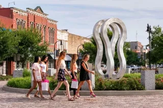 A group of friends shopping during daytime in downtown Goldsboro.
