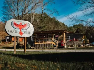 Exterior of charming, cozy Cardinal Coffee building during fall.
