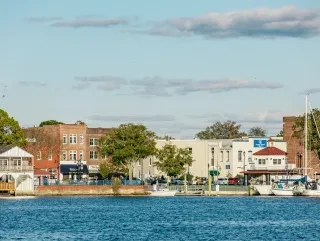 Small town along a waterfront under clear blue skies in Little Washington.