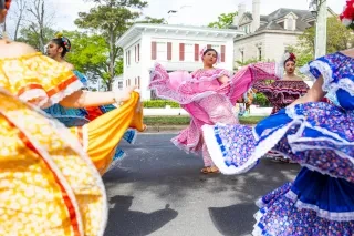 Members of the Itzayan folkloric dance group perform in the Azalea Festival parade in Wilmington, North Carolina.