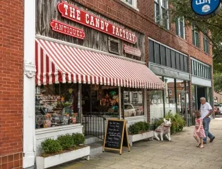 Charming exterior of The Candy Factory in downtown Lexington during daytime.