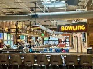Interior of Bourbon Bowl seating areas and bar in Greensboro.