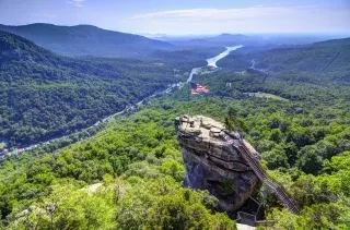 Chimney Rock outcropping with Blue Ridge Foothills stretching into distance.