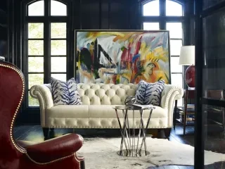Furniture showroom displaying beautiful couches, chair and art.